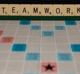 scrabble letters spelling out teamwork